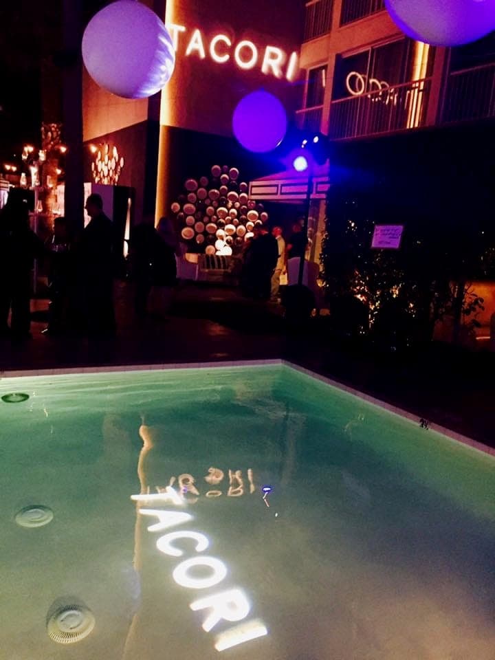 Poolside brand activation with logo projections in the water
